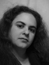 black and white photo of white woman with long wavy