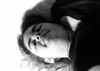 black and white photo of white woman shot from below I'm leaning over the camera, I think I was going for a more artsy or playful shot